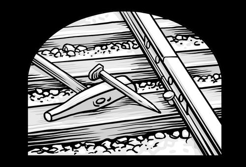 hammer and spike on railroad tracks