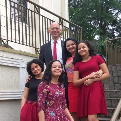 family standing on stairs