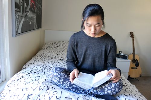 young woman reading scriptures