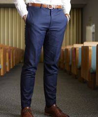 A missionary models appropriate clothing. He wears correct and approved suits and dress pants.