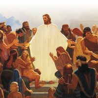 The resurrected Jesus Christ appearing to the Nephites and Lamanites. Christ is depicted wearing white robes. The Nephites and Lamanites are reaching toward Christ and kneeling before Him in adoration.