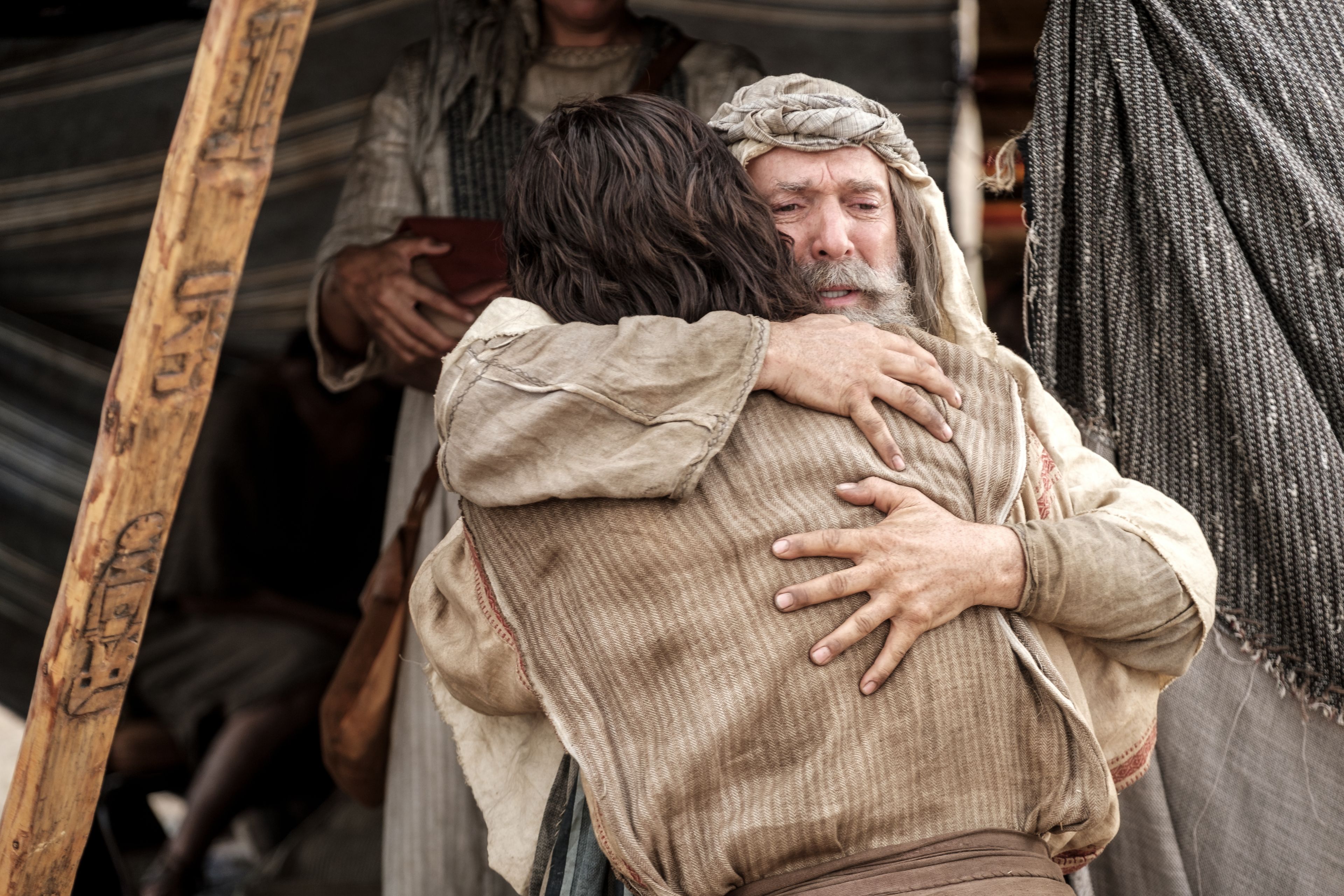 Lehi embraces Nephi after he asks whither to go to obtain food in the wilderness. 