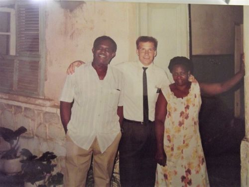 three people in front of building