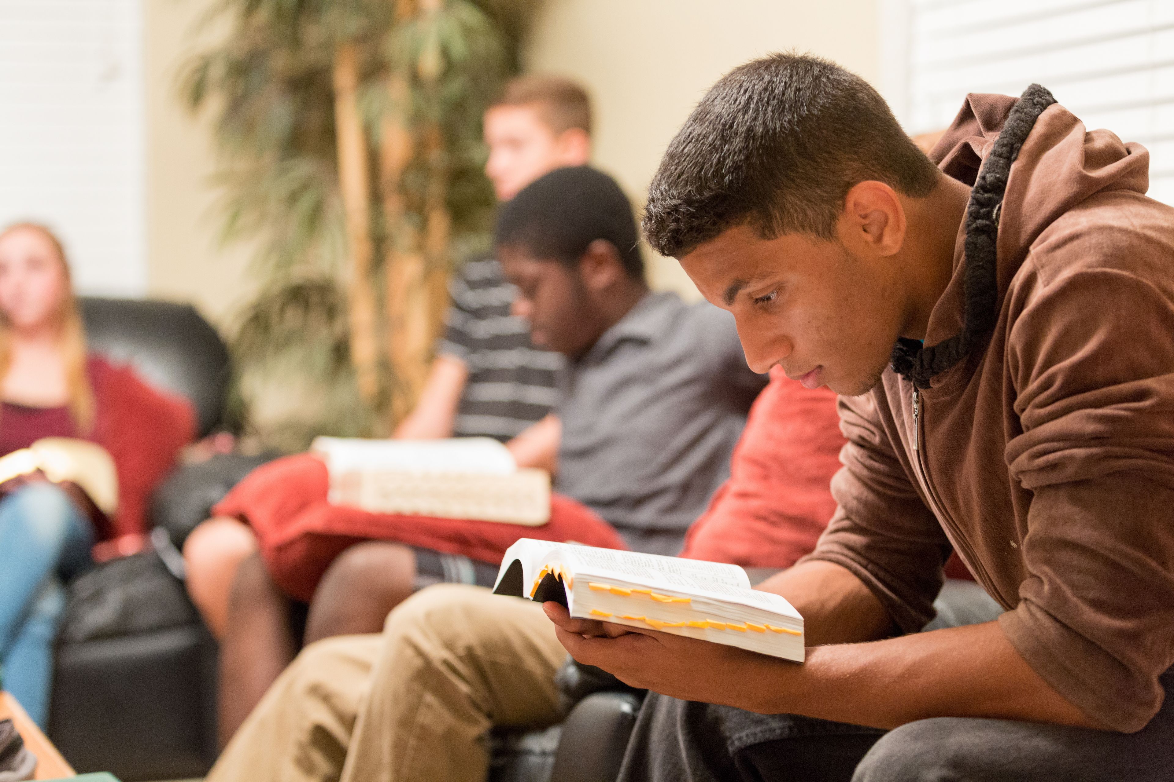 A group of youth reading scriptures together in Florida.