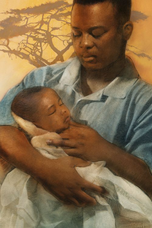 父親抱著出生不久的女兒