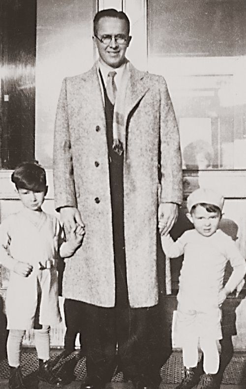 Ezra Taft Benson holding the hands of his two young sons, Mark and Reed.  taken in Boise, Idaho.