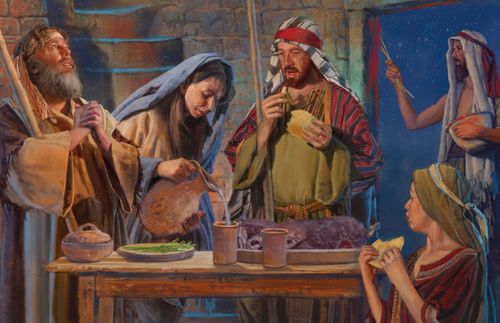 a family of Israelites eating the Passover meal