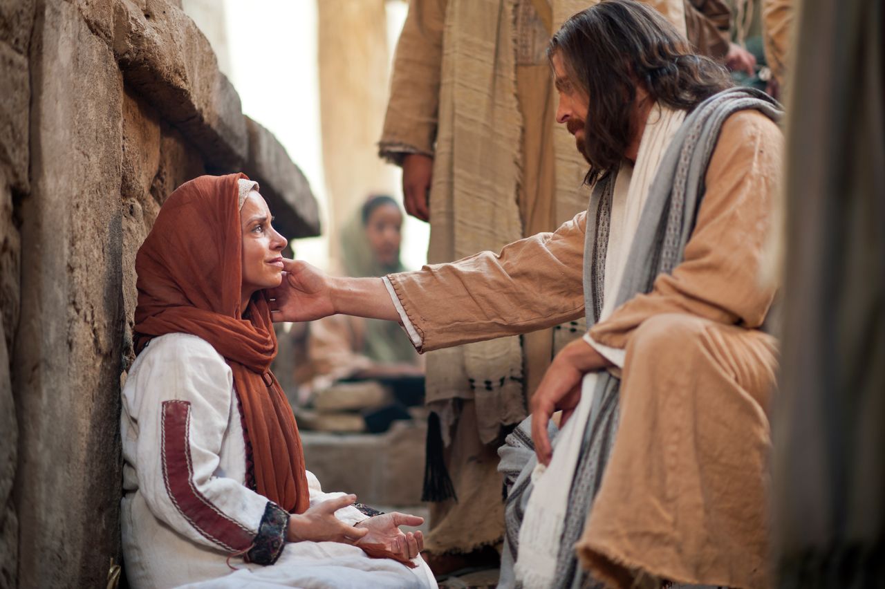 Jesus Christ heals a woman who through faith touched His clothes and was healed