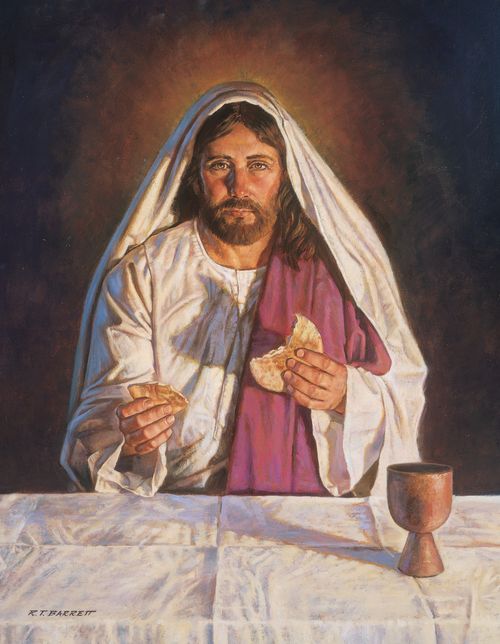 A painting by Robert T. Barrett of Jesus Christ sitting at a table and breaking bread as He introduces the sacrament.