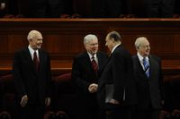 Elder M. Russell Ballard shakes the hand of  President Thomas S. Monson at the October 2010 General Conference.