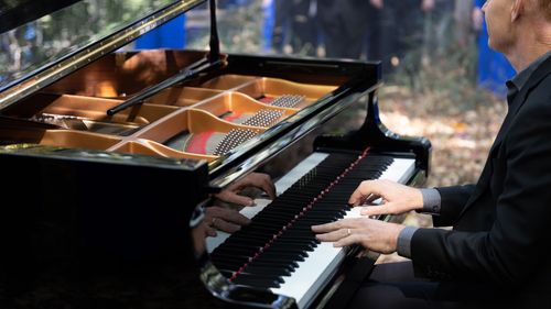 Pianist of The Piano Guys, Jon Schmidt, playing at the Motion Picture Studio surrounded by The Tabernacle Choir at Temple Square for a filmed segment for Music and the Spoken Word, October 8, 2022.