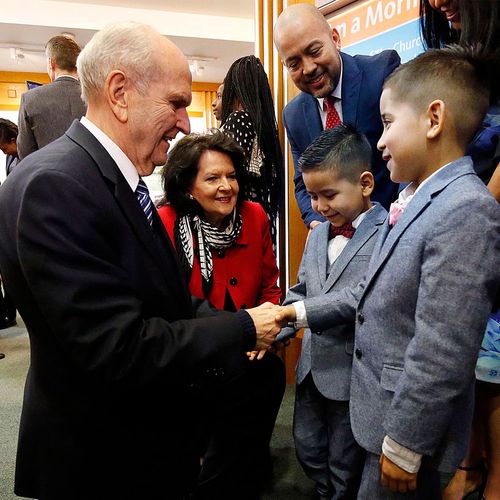 President Nelson and Sister Nelson greeting two boys