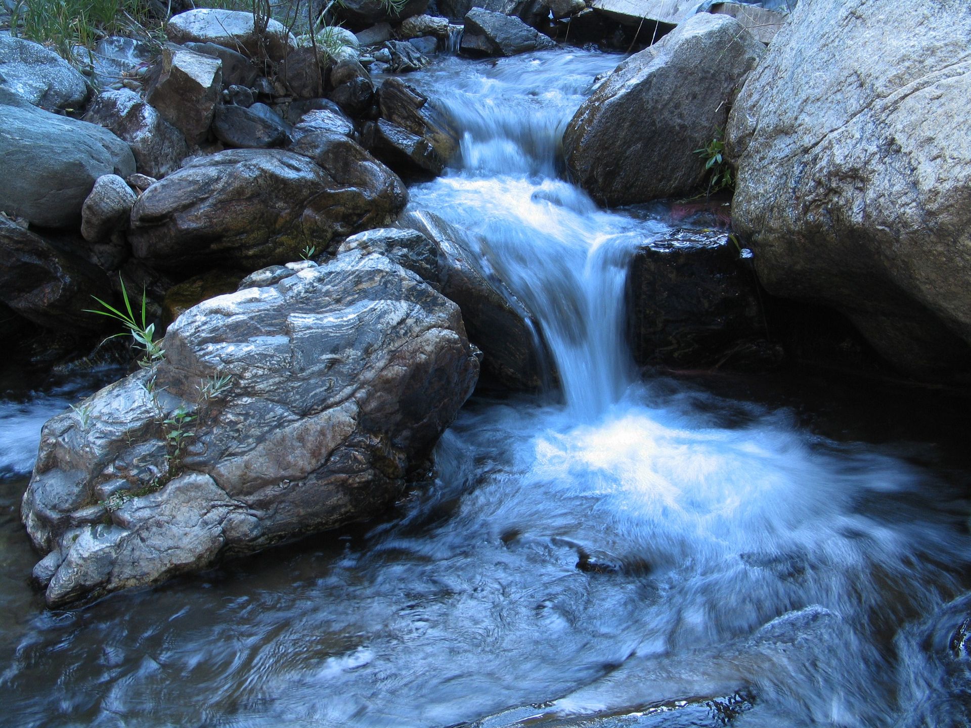 Water flowing down in a stream.