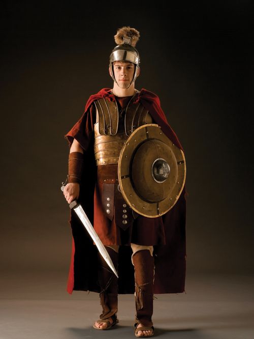 A young man dressed in New Testament–era armor with a sword and shield.