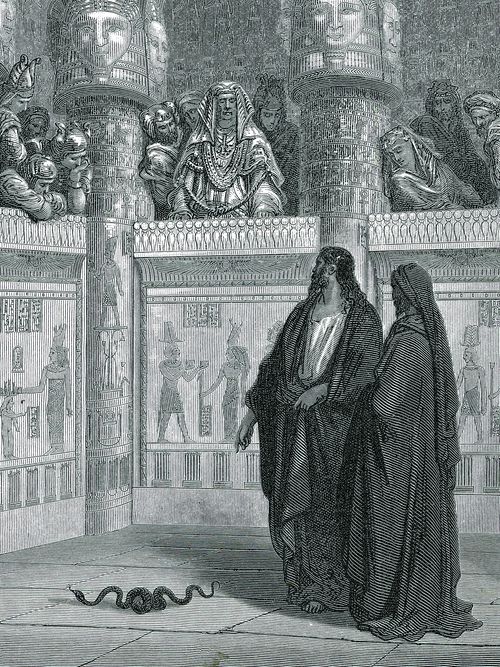 Moses and Aaron stand before the Pharaoh with a serpent on the ground
