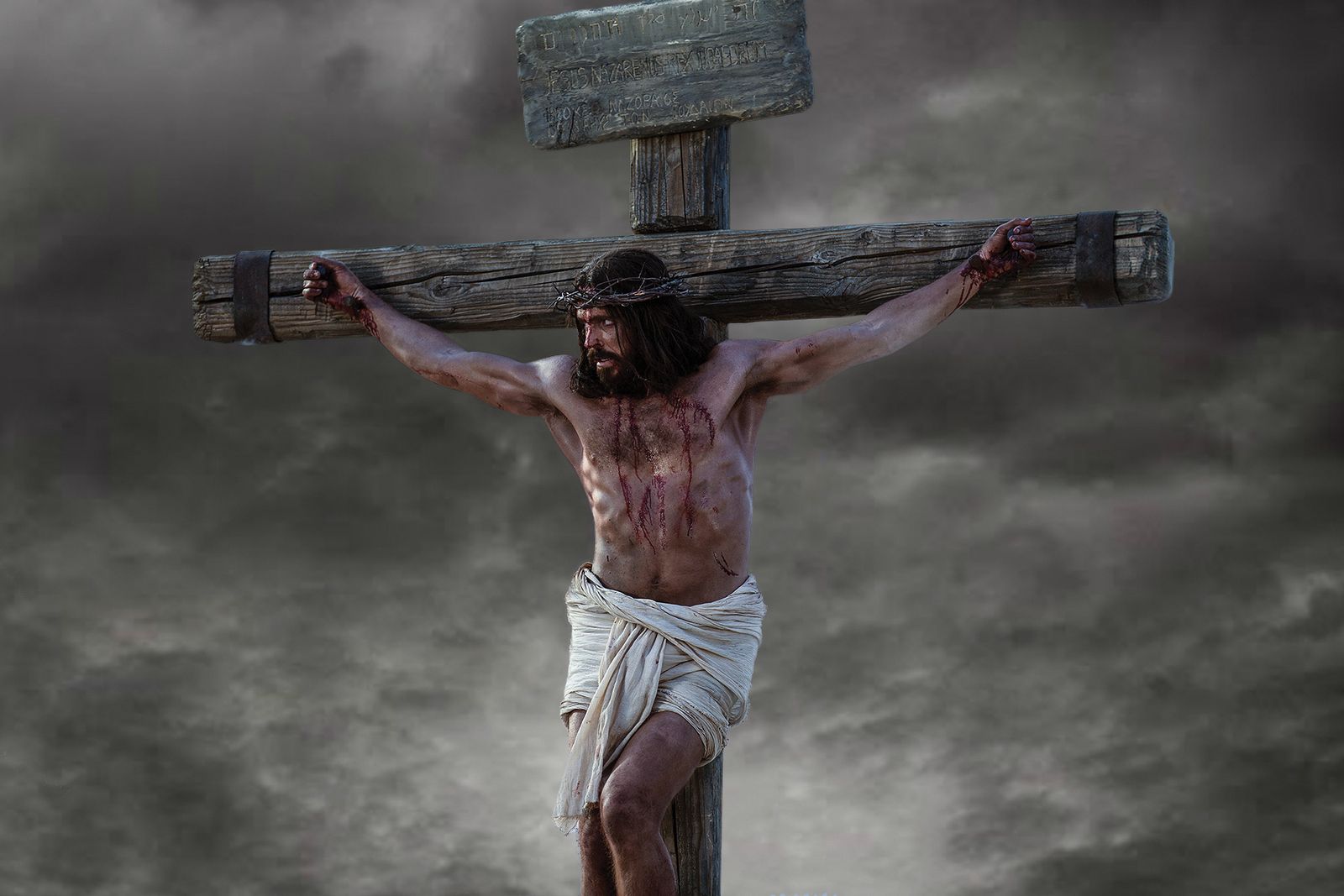 Jesus prays to the Father as He is nailed up on the cross.