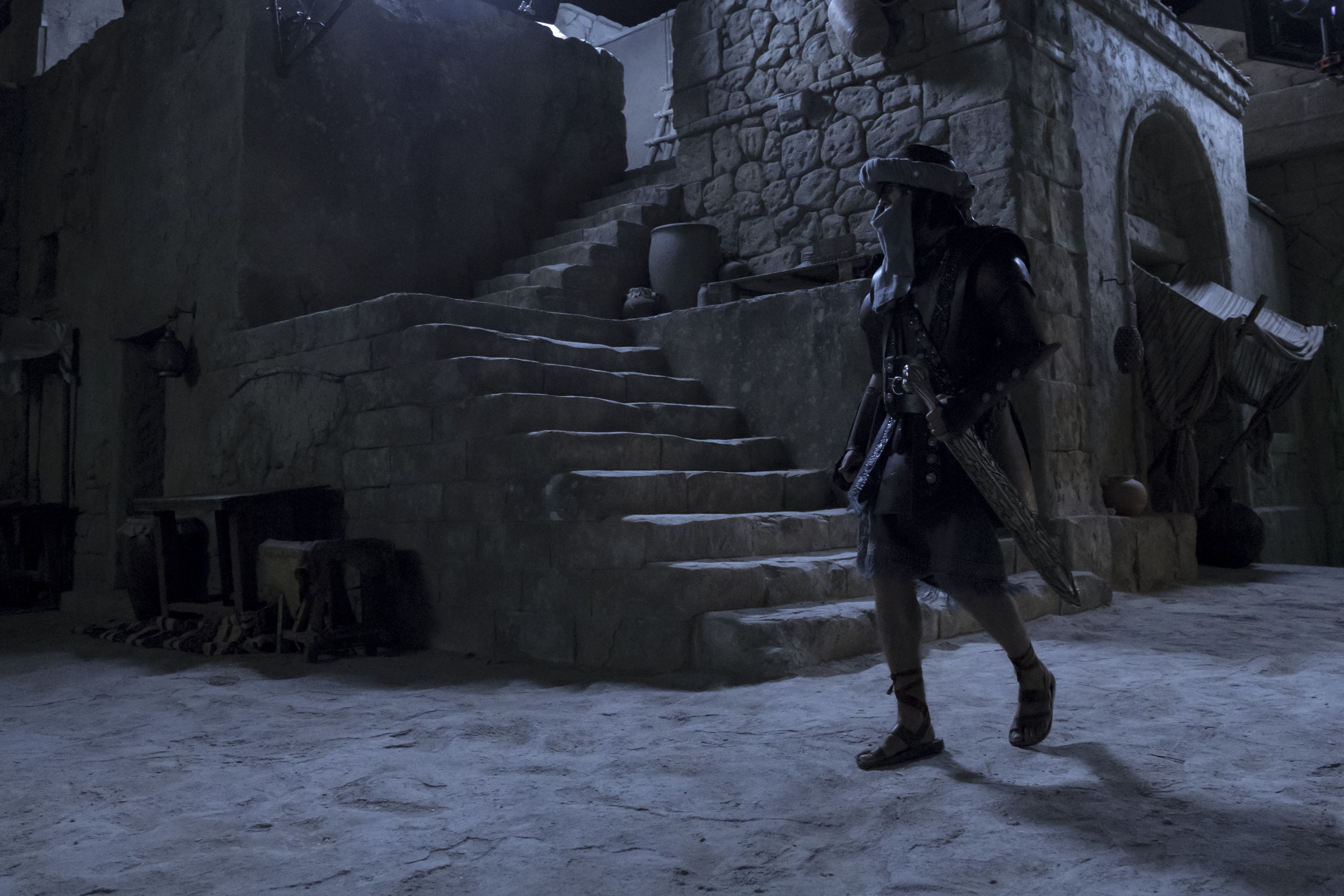 Nephi, disguised as Laban, walks the darkened streets of Jerusalem.