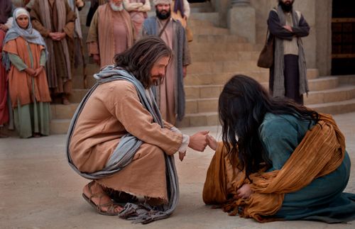 the Savior reaching out to the woman taken in adultery