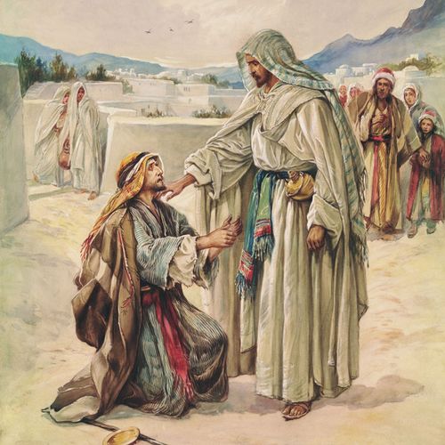 man kneeling before Jesus