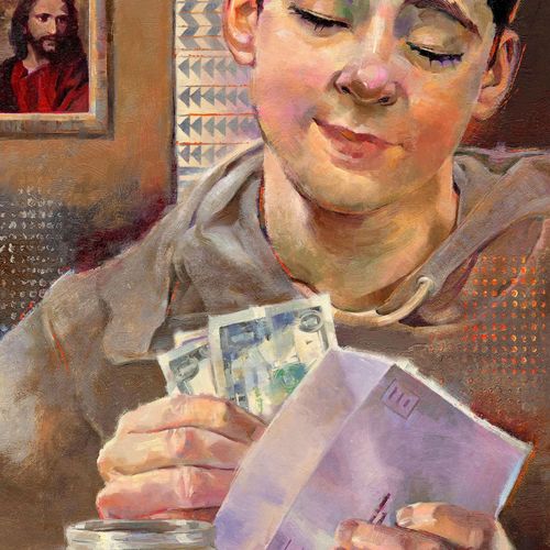 a young man putting money into a tithing envelope