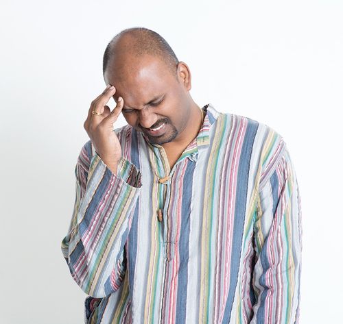 man holding injured head