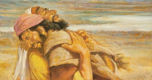 The Old Testament characters Jacob and Esau embracing one another. A desert landscape is portrayed in the background.