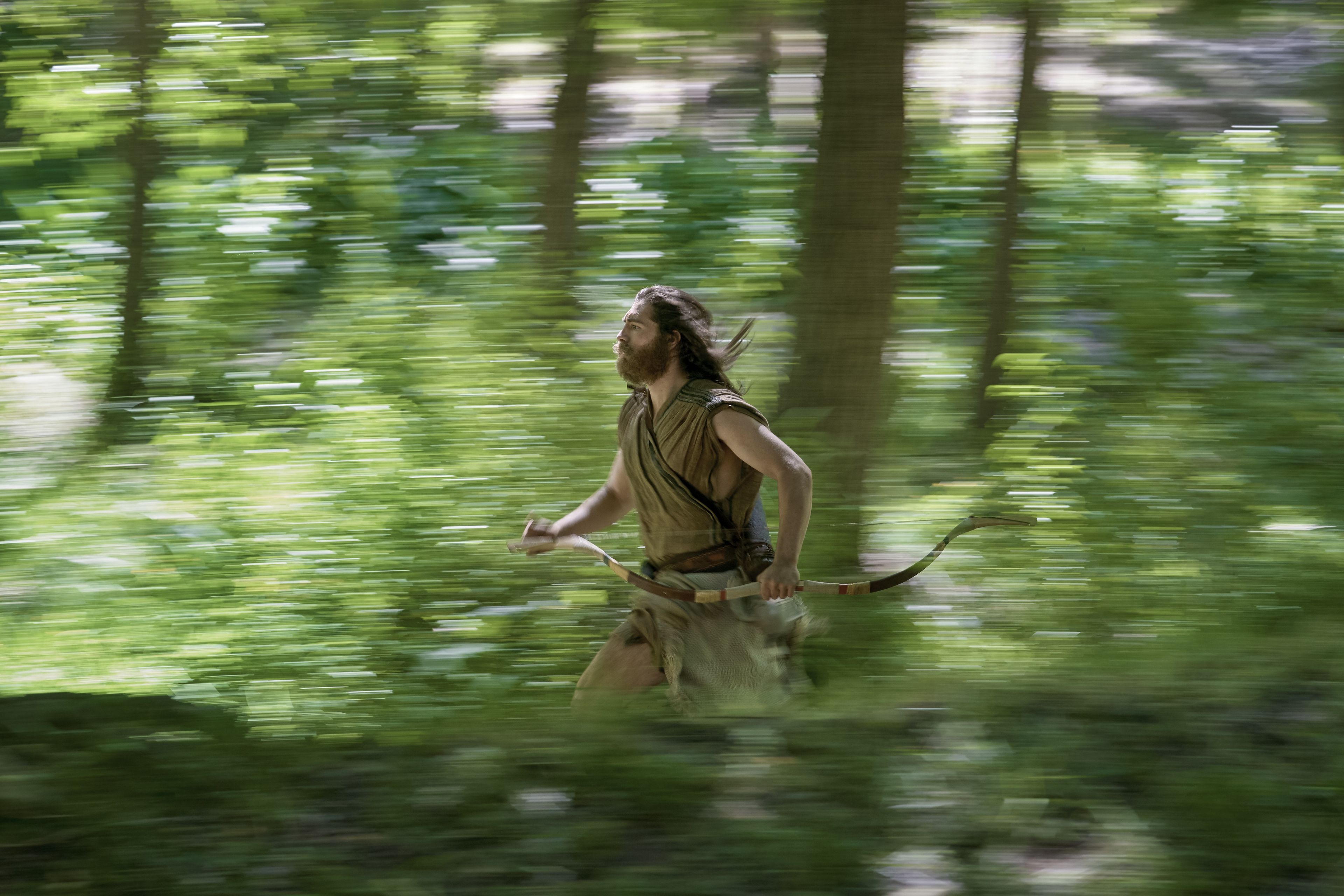 Nephi runs through the woods to warn his family. 