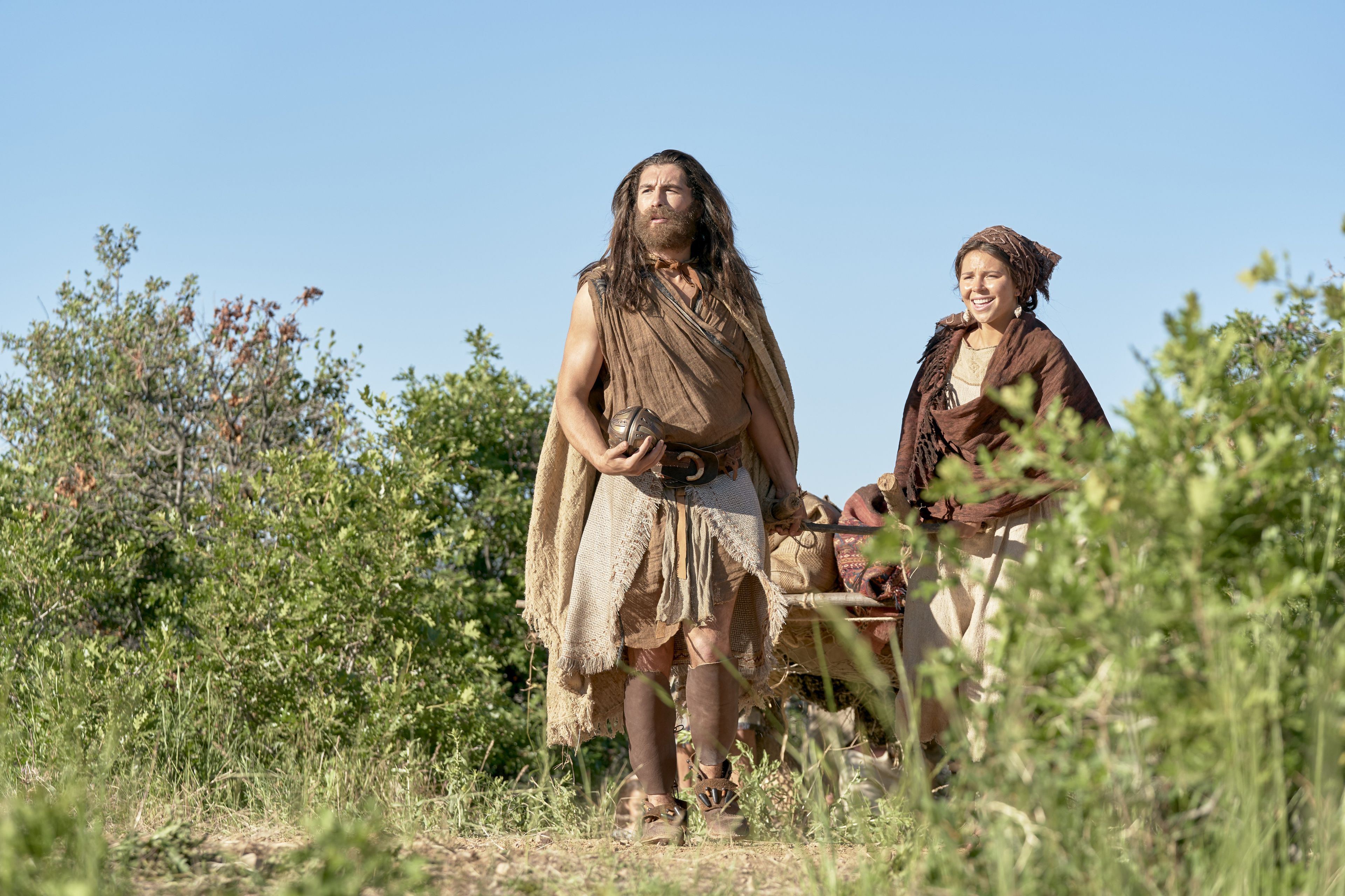 Nephi holds the Liahona, standing next to his wife.