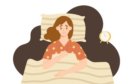 a woman lying in bed and not being able to sleep