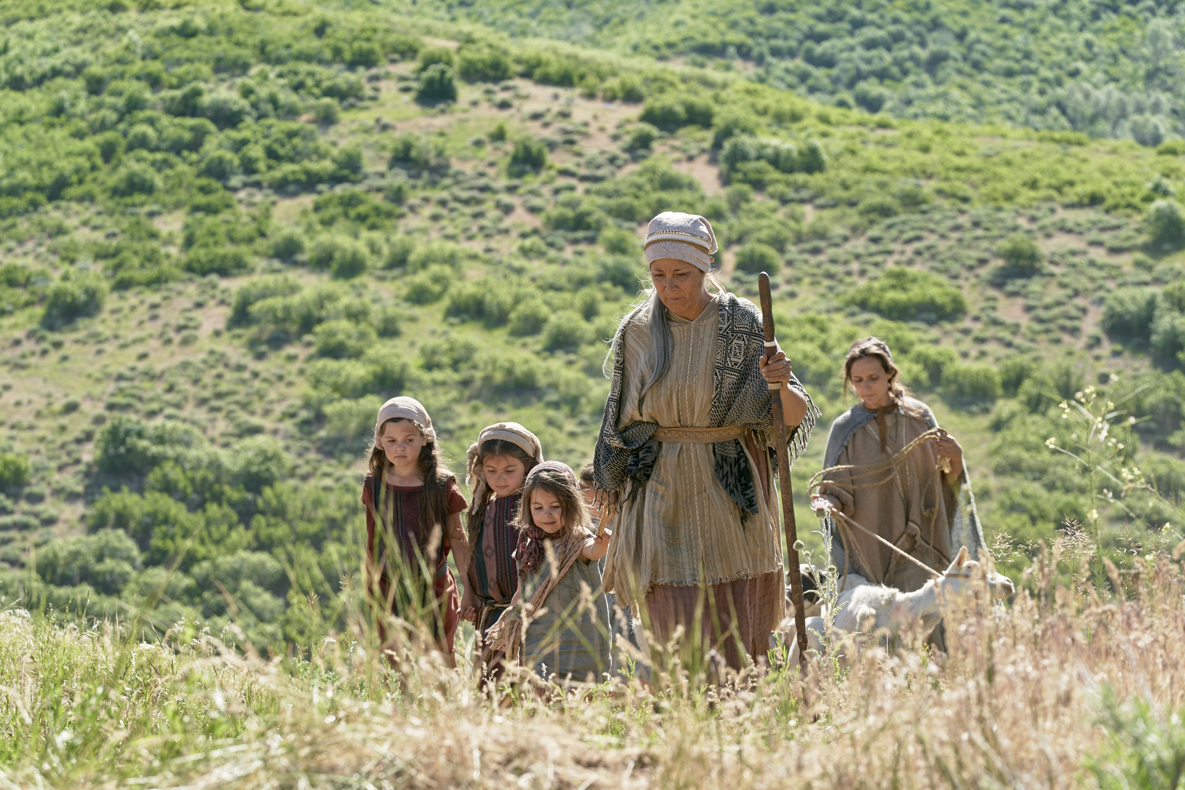 Sariah leads the children up the hillside as they flee the Land of First Inheritance. 