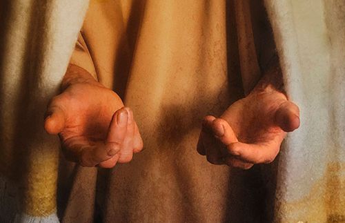 Jeesuksen Kristuksen kädet Hänen edessään