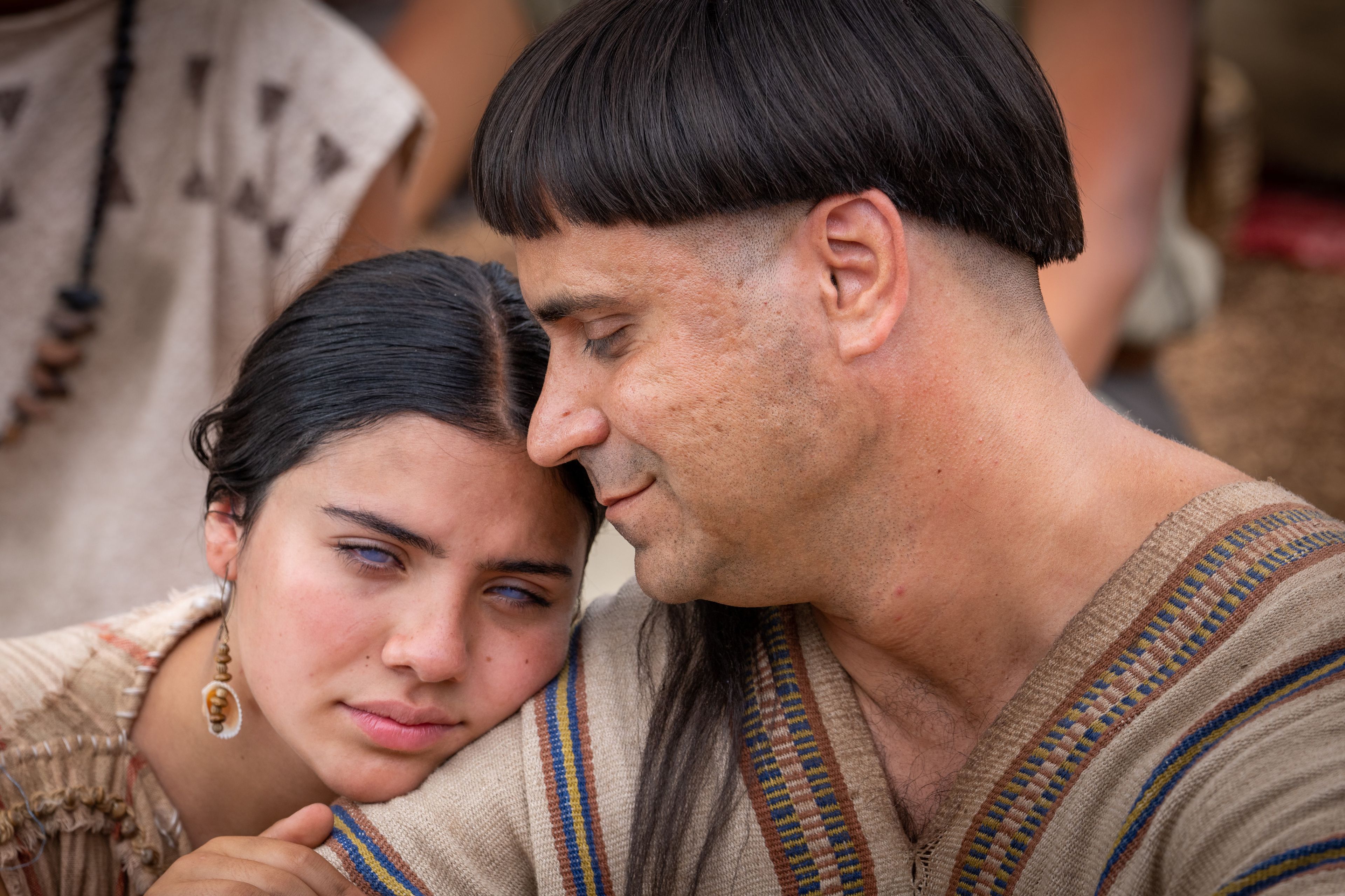A blind girl and her father listen as Jesus Christ teaches the higher law to Nephites outside of the Bountiful Temple.
