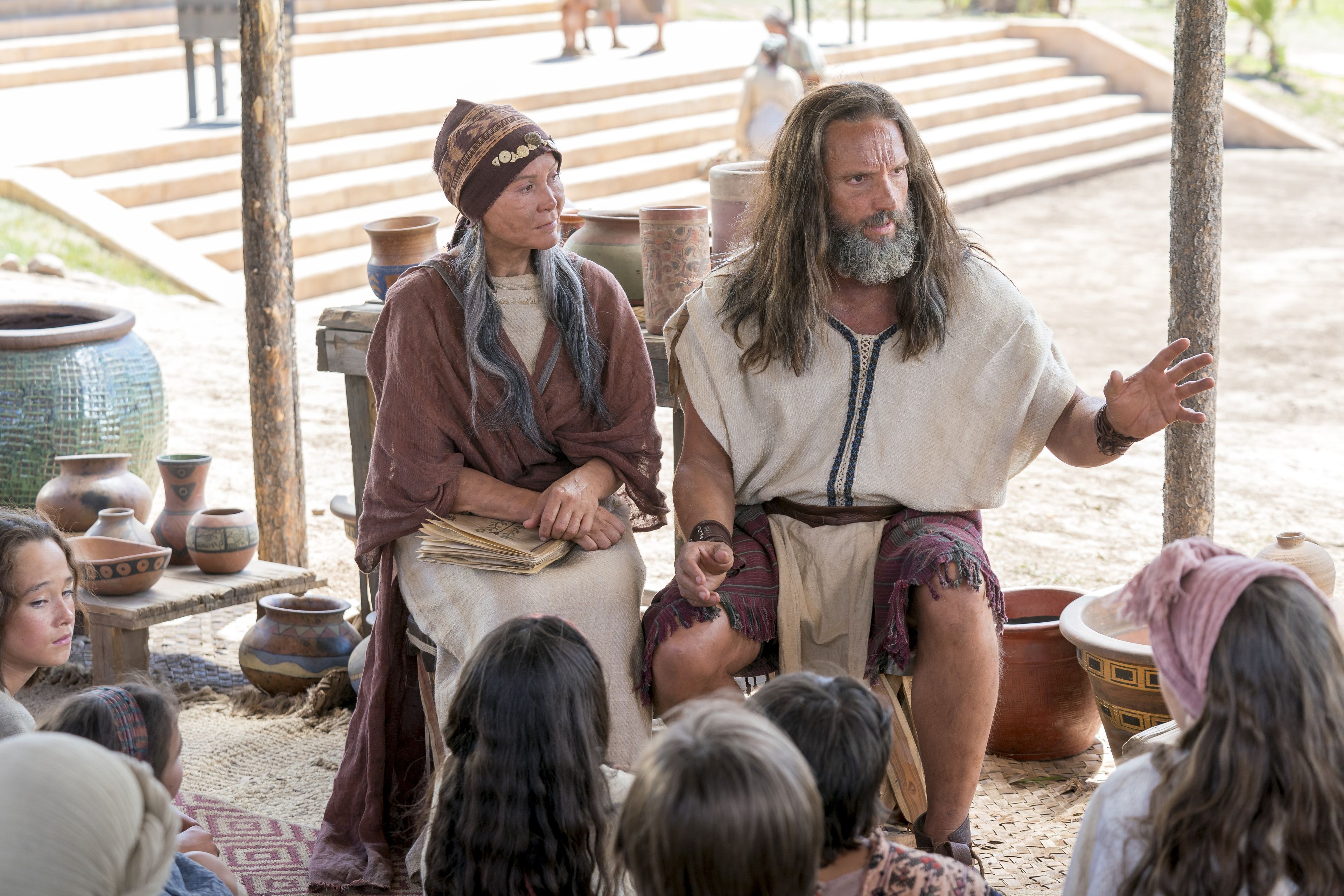 Nephi and his wife teach the Nephite children about baptism and the doctrine of Christ.
