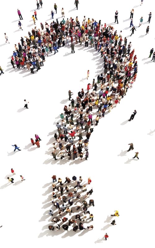 People standing in the shape of a question mark.