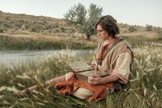 Nephi sitting by a stream