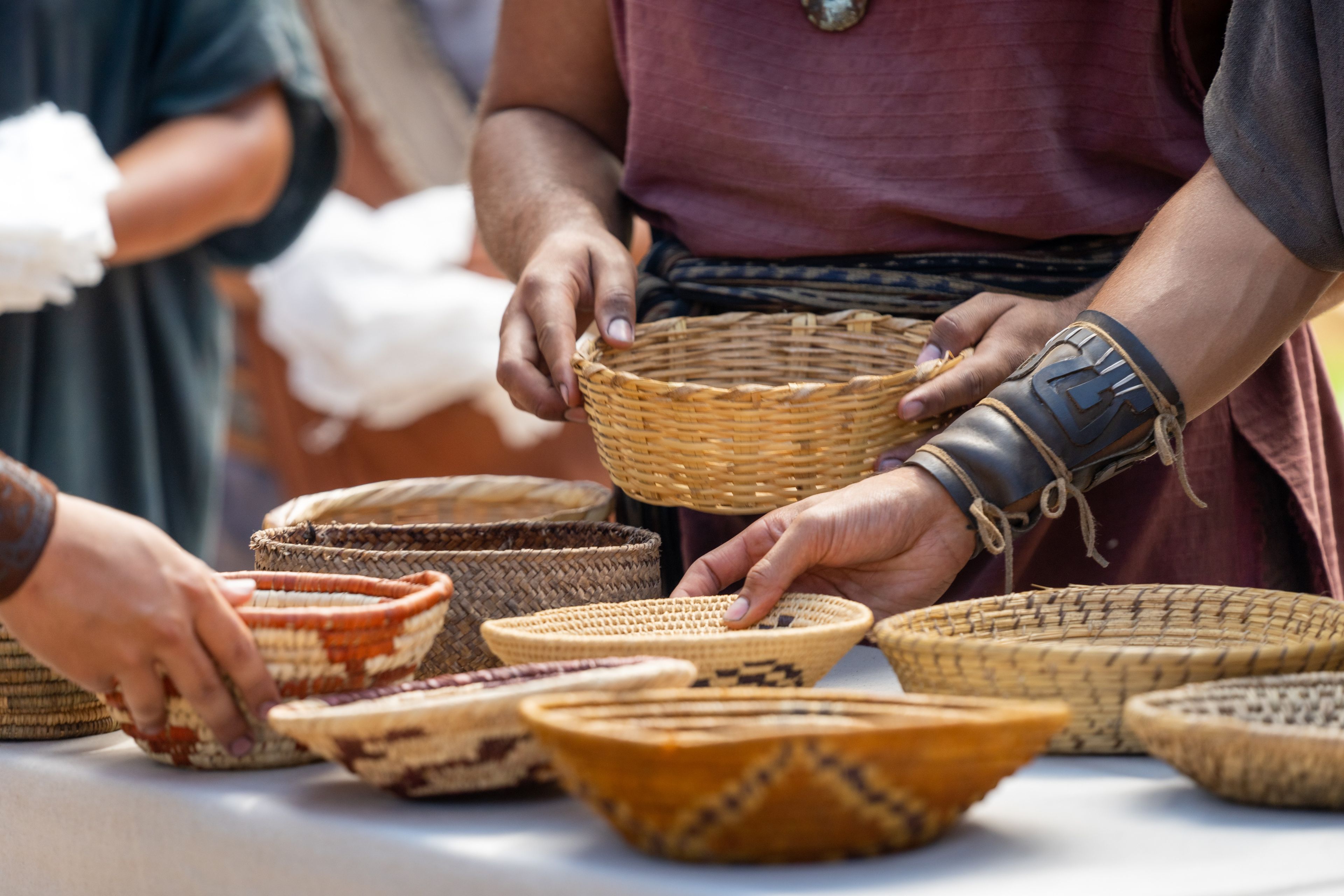 Mathonihah and Mathoni gathering bread in baskets.