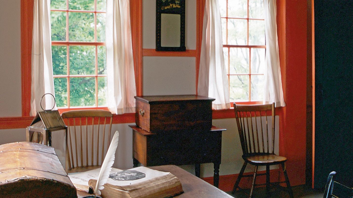 Interior of the John Johnson home in Hiram, Ohio.  Books, papers and a trunk on a table.