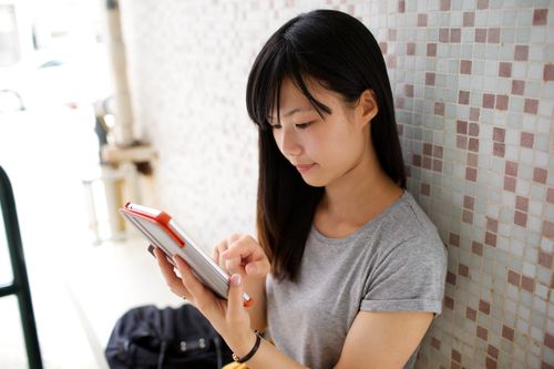 girl reading on tablet
