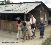 Elder M. Russell Ballard visits with children in Suriname