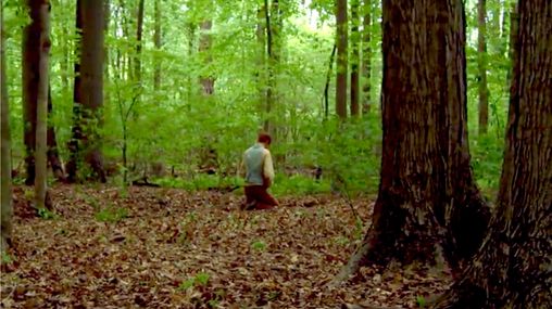 Joseph Smith in a grove of trees.