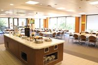 Photos of working and eating areas inside the England Missionary Training Center