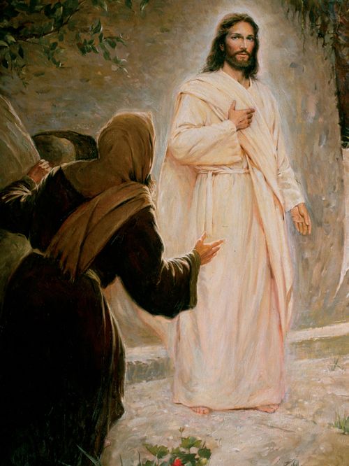 Christ is seen with marks on his hands, dressed in a white robe.