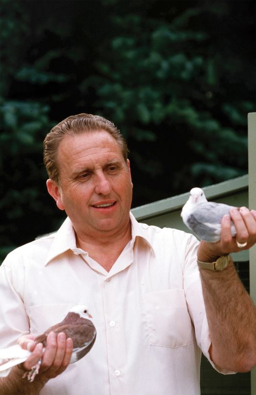 Thomas S. Monson holding pigeons