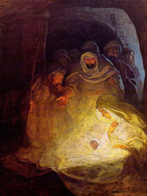 Mary, Joseph and the baby Jesus in the stable with shepherds in the background.