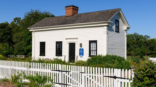 Historic Nauvoo:  house with white siding, white picket fence