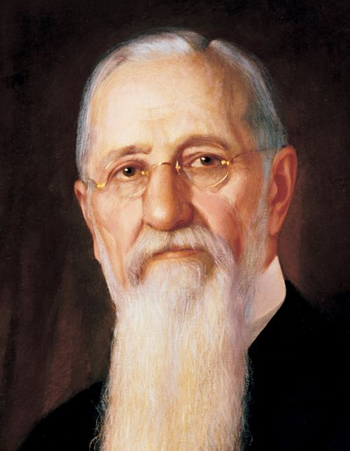 A painted portrait by A. Salzbrenner of Joseph F. Smith with a long white beard and small round glasses.