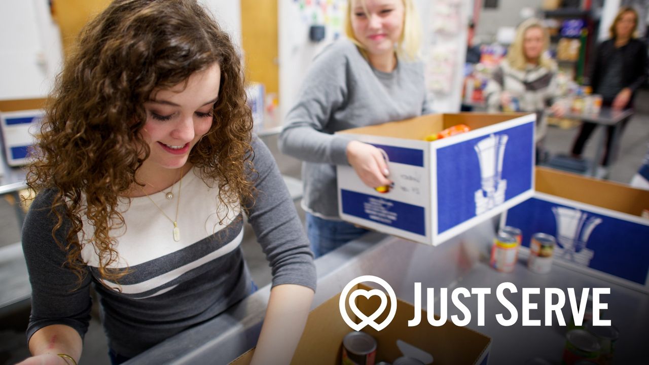 Two young women serving in the food bank