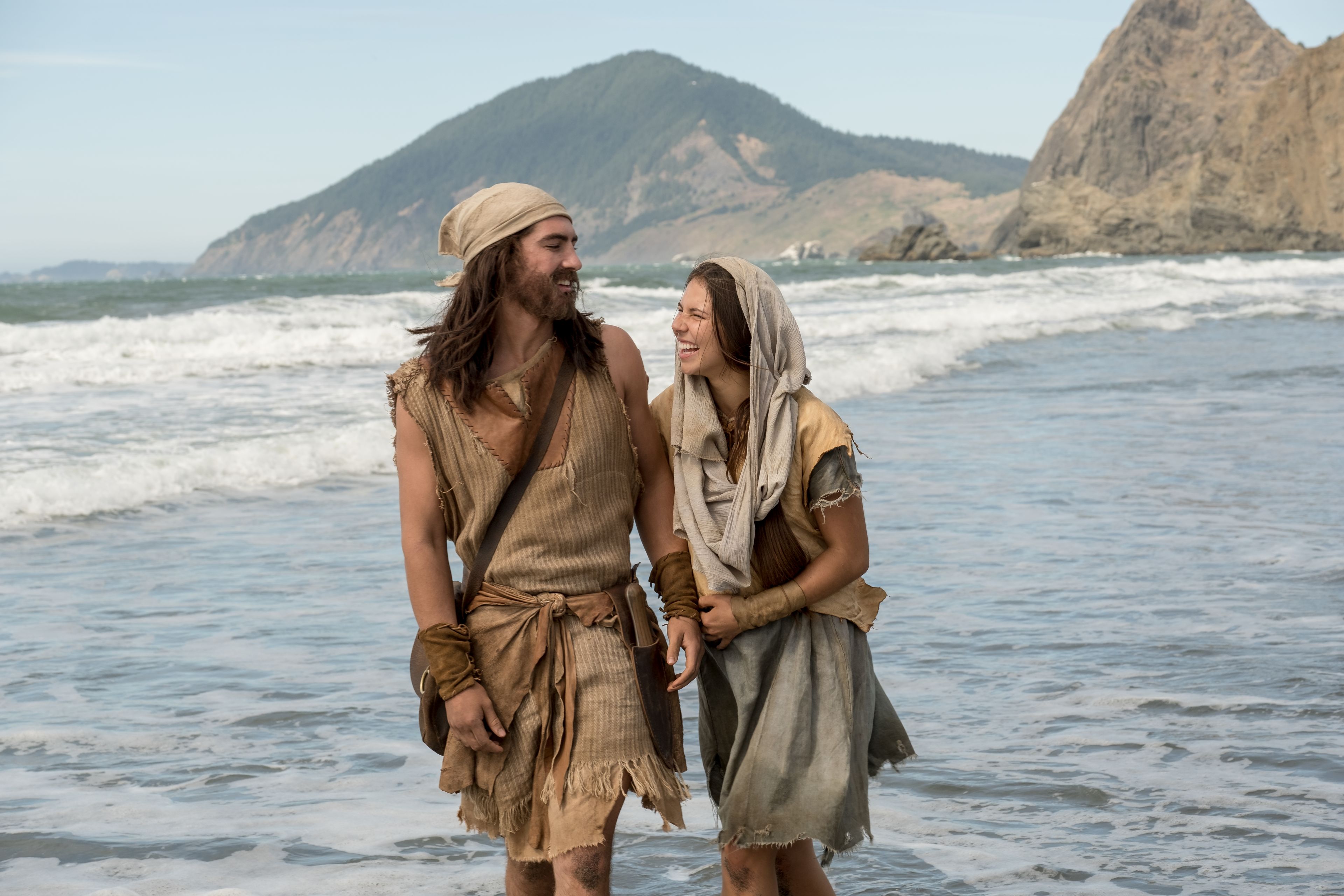 Nephi and his wife walk along the shore.
