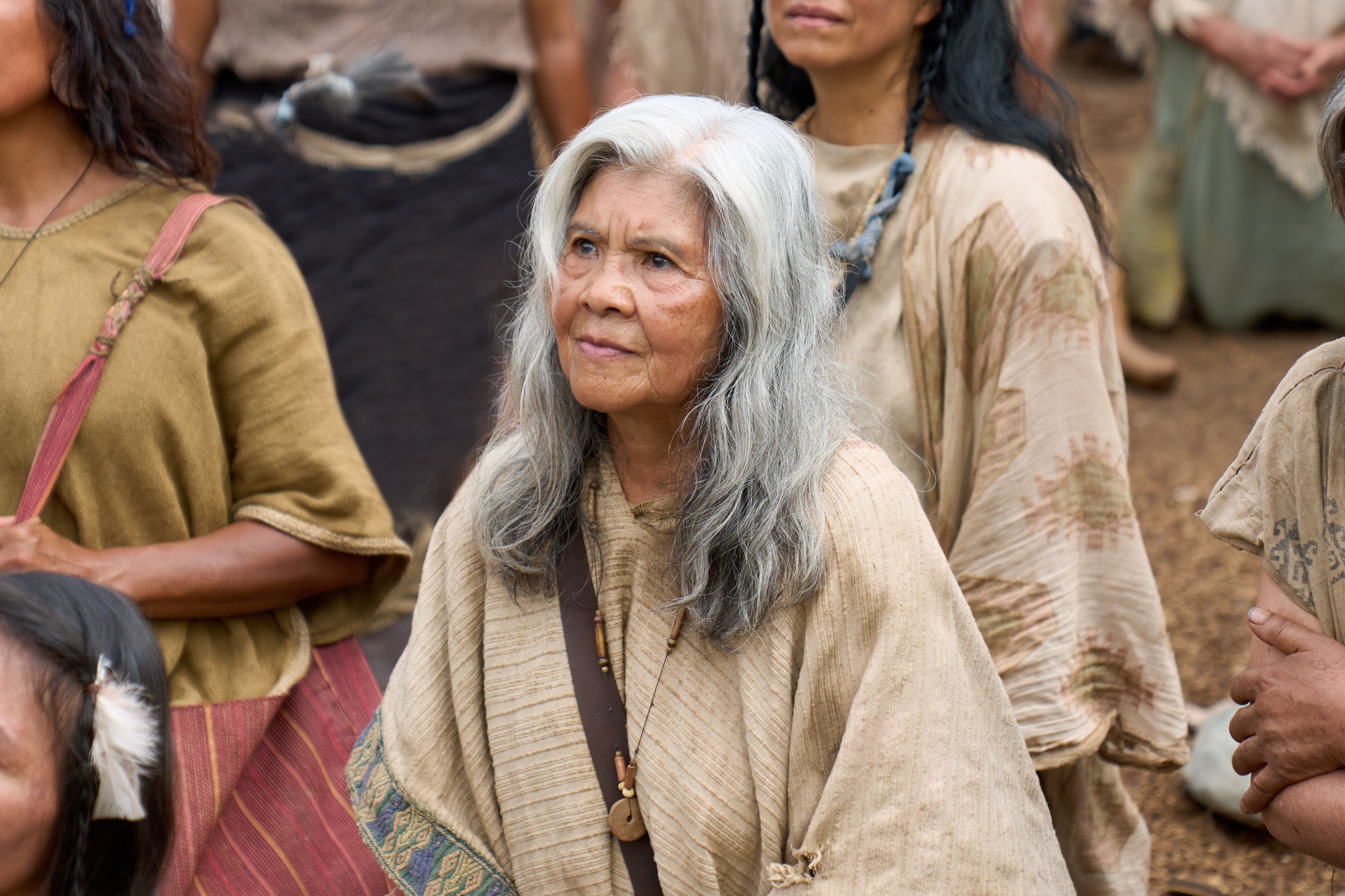 An elderly woman listens to the resurrected Savior, Jesus Christ, as he ministers to the inhabitants of the Americas.