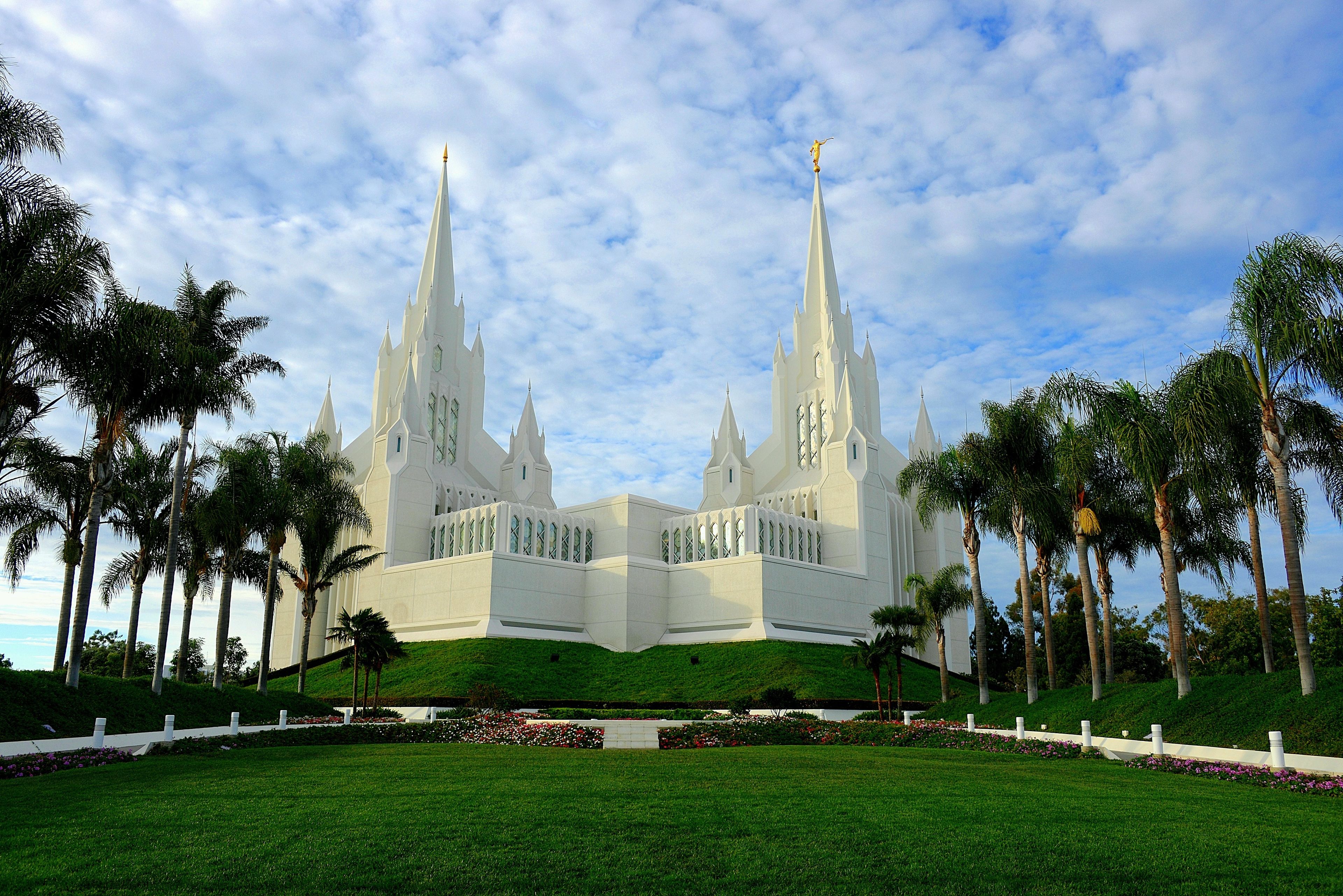 The San Diego California Temple and its lawns on a partly cloudy day.